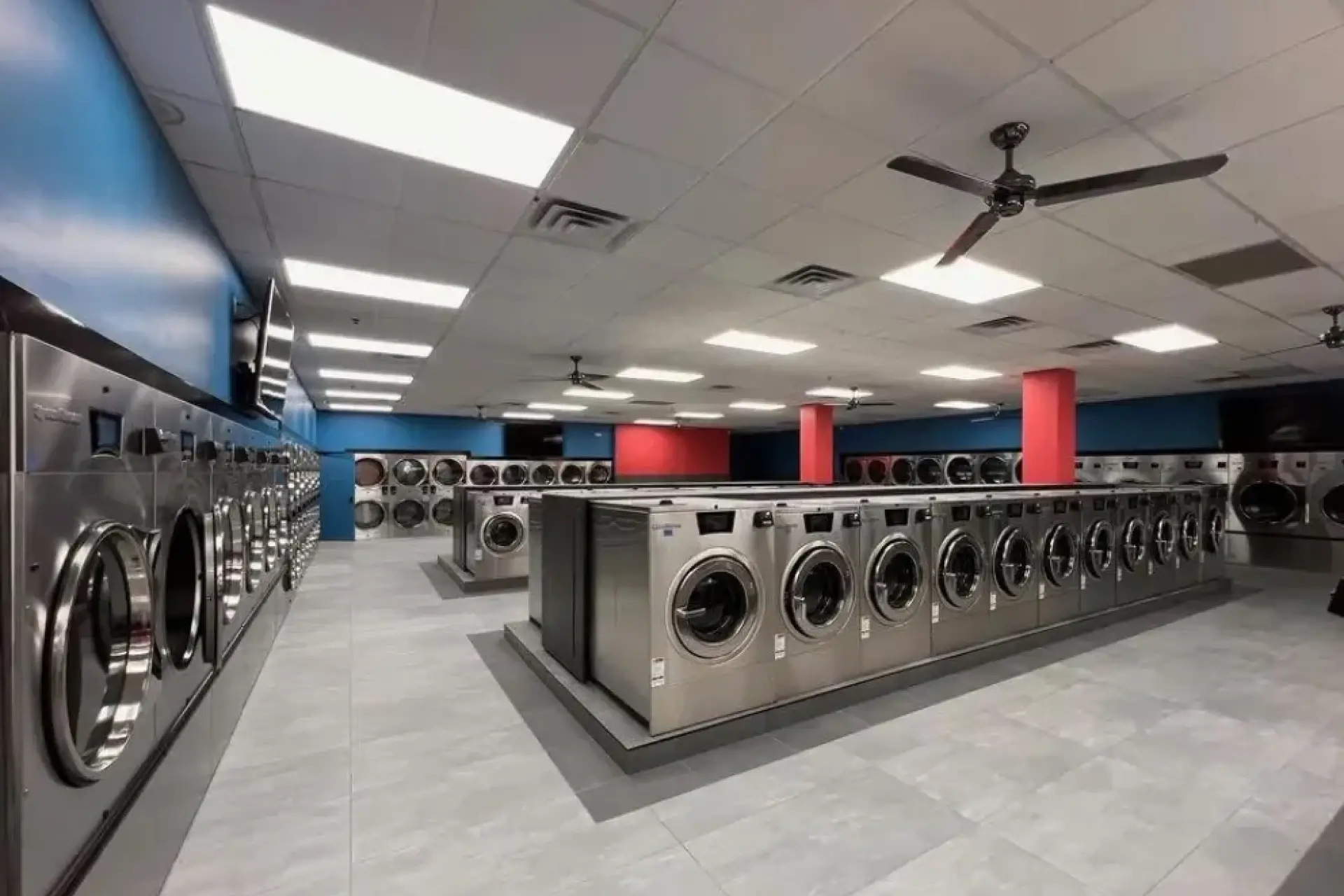 Comfortable seating area and amenities for customers at Lux Laundromat